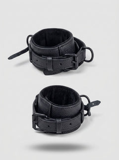 Luxury Faux Leather Bondage Bed Restraint Kit close-up of two padded black PU leather cuffs with buckles and attachment rings for bed restraint