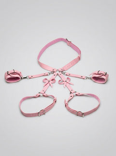 Close-up details of the Strict Bondage Harness with Bows Pink ML, a high-quality bondage harness with chic bows for sophisticated play.