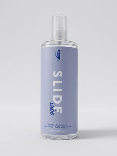 Loving Joy Slide Water-Based Lubricant alongside natural ingredients showcasing its commitment to plant-based, chemical-free intimate care.