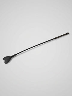 Elegant display of the Bound Nubuck Leather Heart Crop, highlighting its comfortable leather-bound handle for perfect grip during intimate moments.