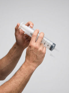 Prowler RED 300cc syringe for hygiene, featuring a clear plastic body with red accents and a precise applicator tip.