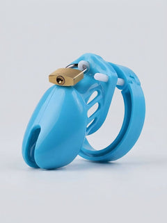 Stylish The Scandals Clear Black Pink and Blue Cock Cage displayed on a plush background, ideal for erotic sessions.