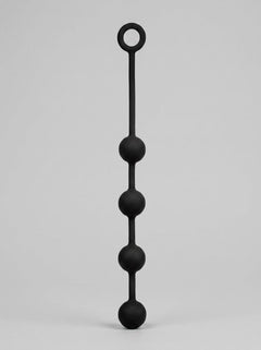 Prowler RED Silicone Anal Beads displayed upright, highlighting the elegant tapered shape and premium black finish.