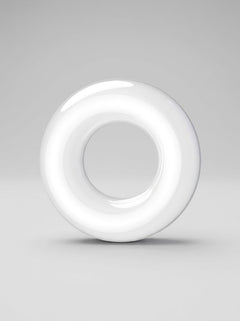 White JoyRings Doughnut Stretchy Cock Rings (3 Pack) standing upright to showcase the smooth rounded profile of these luxury cock rings.