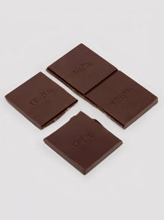 The Oh Collective Date Night Aphrodisiac Chocolate - indulge in dark chocolate infused with Maca, Ginseng, and strawberry popping candy.