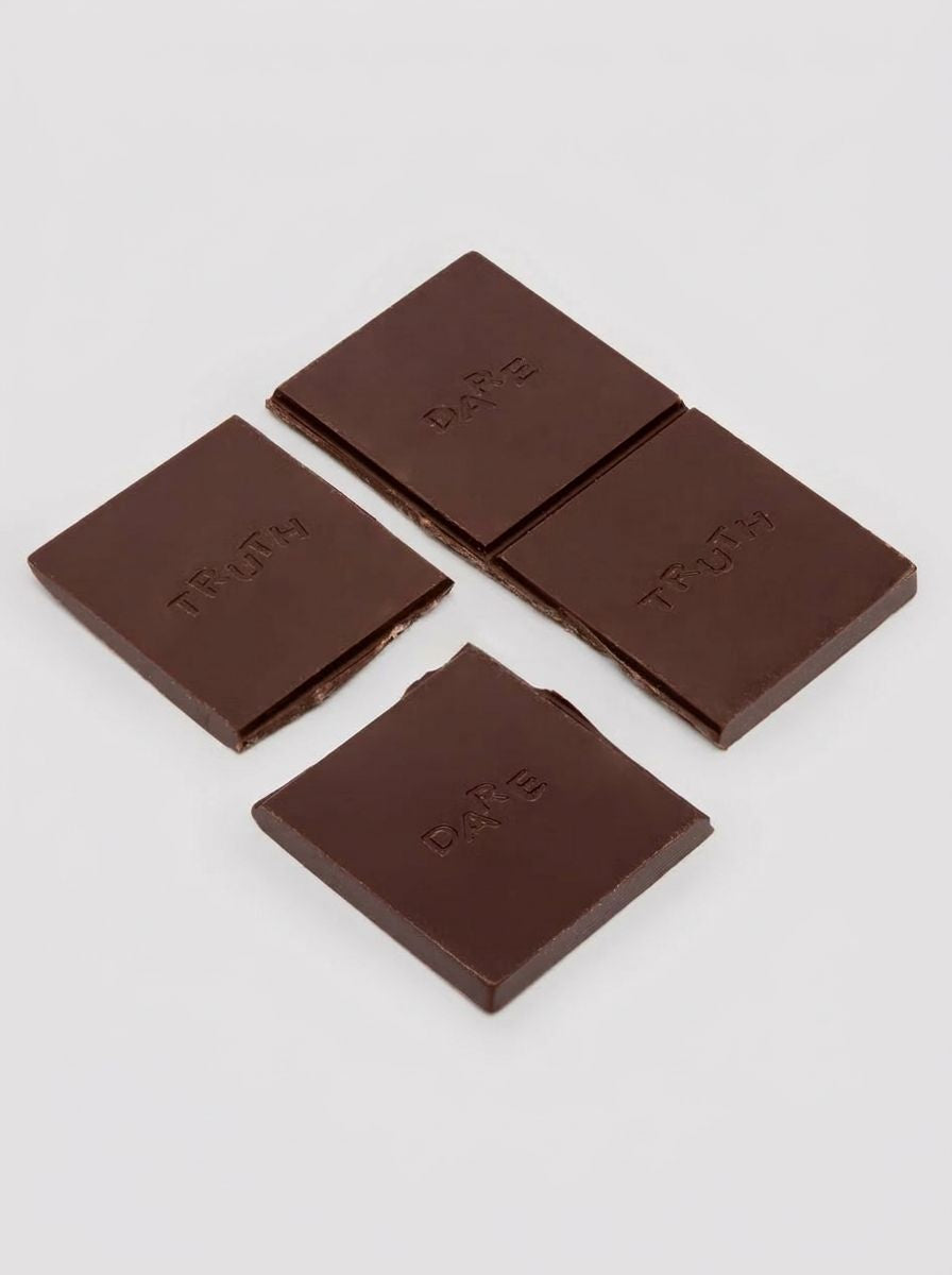 The Oh Collective Date Night Aphrodisiac Chocolate - indulge in dark chocolate infused with Maca, Ginseng, and strawberry popping candy.