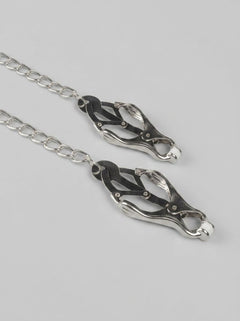 High-quality Bound to Please Squeezer Teaser Clover Nipple Clamps displayed with silver chain, representing luxury and versatility in nipple play for intimate adventures.