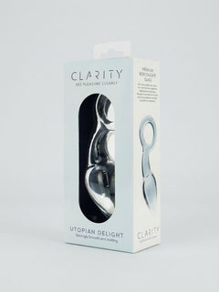 Clarity Utopian Delight 3.5 Inch Glass Butt Plug packaging displayed at an angle with the transparent product visible inside