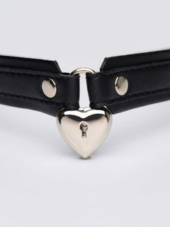 Stylish model wearing the Strict Locking Heart Collar, demonstrating its adjustable fit and luxurious PU leather texture, ideal for intimate occasions.