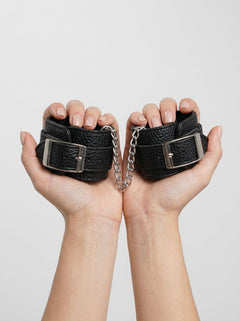 Lux Fetish Heavy-Duty Leatherette Cuffs-Unisex designed for bondage and sensual exploration, highlighting the adjustable fit and durable material.