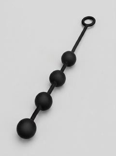 Stylish Prowler RED Silicone Anal Beads in a sleek position, emphasising their luxury design and usability.