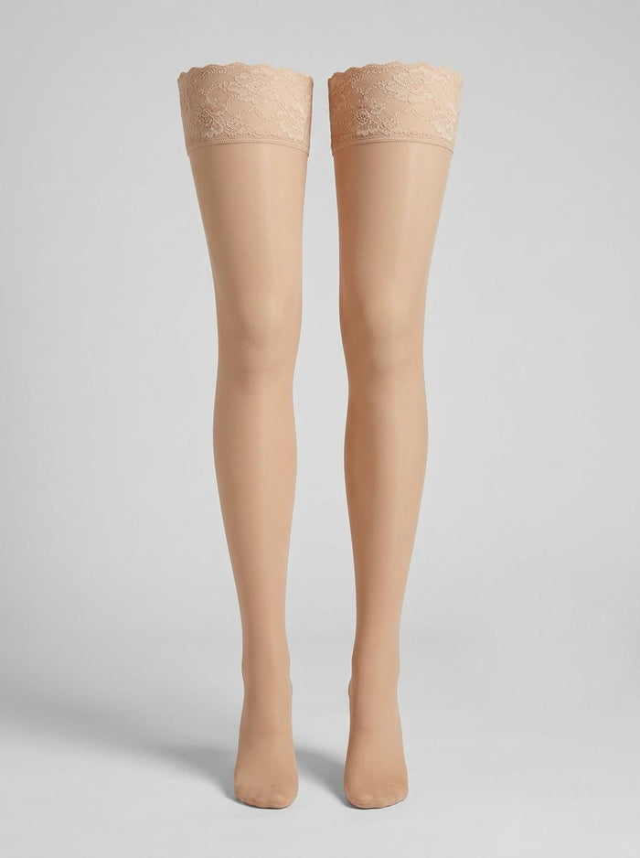 Luxury sheer thigh high stockings with lace top, available in Black, White, Red, and Nude, perfect for enhancing your lingerie collection.