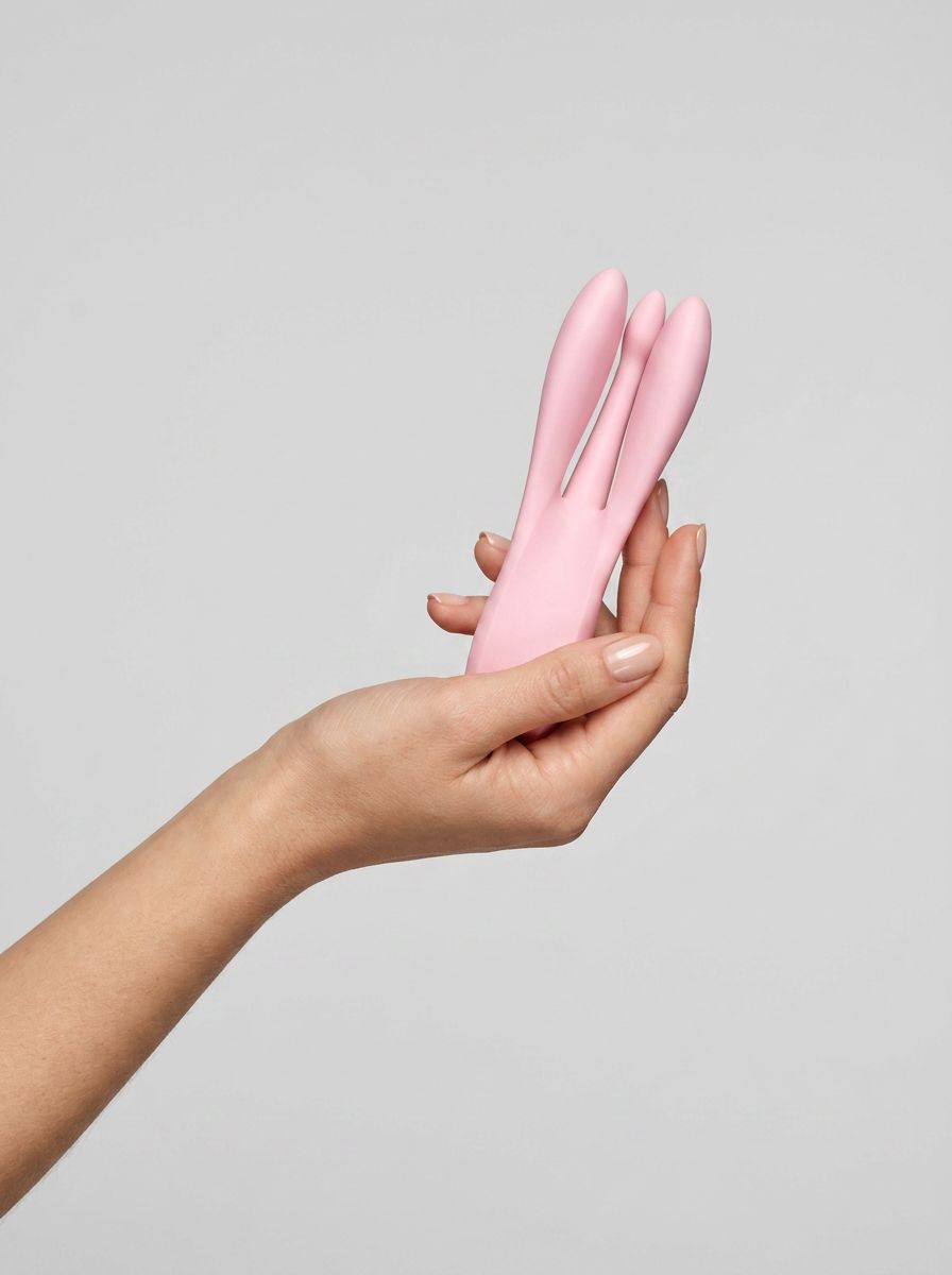Satisfyer Threesome 1 – Pink Lay-On Triple Motor Vibrator showcasing its elegant design and luxurious finish, ideal for ultimate pleasure and stimulation.