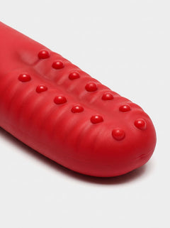 Close-up of the textured silicone tip on the Dual Motor Rose Tongue Finger Vibrator Sleeve, highlighting the raised massage details of this red rose tongue finger vibrator.