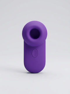 Me You Us Signature The Travel Tapper Pulsating Clitoral Suction Vibrator showcasing the smooth external surface of this clitoral suction vibrator