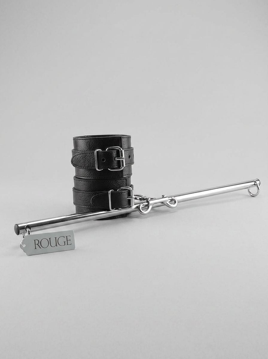 Adjustable leather leg spreader bondage bar with cuffs from Rouge Garments Ltd, featuring sturdy straps and secure fastening.