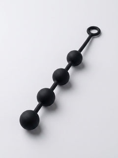 Close-up of Prowler RED Silicone Anal Beads, showcasing their alluring smooth finish and ergonomic shape.