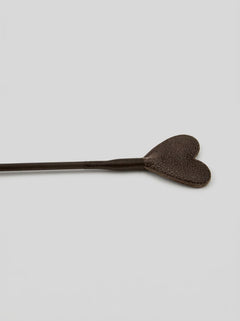 Stylish presentation of the Bound Nubuck Leather Heart Crop, featuring its flexible design for enhanced control during intimate play experiences.