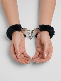 Loving Joy Furry Handcuffs displayed elegantly, featuring adjustable cuffs with a plush faux fur lining for comfort and a quick-release unlocking system for safe bondage play.