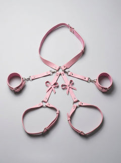 Strict Bondage Harness with Bows Pink ML elegantly displayed, showcasing its adjustable features as a premium bondage harness.
