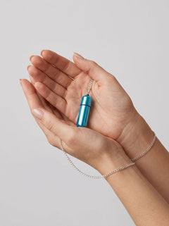 Close-up of the Power Bullet MiVibe Bullet Vibrator Necklace showcasing its stylish blue finish and multi-speed functionality.