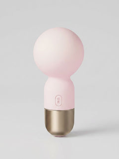 Pokewan Pocket Mini Vibrating Wand Massager in pale pink, shown upright with a rounded head and gold-tone base
