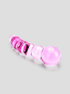 Spectrum Ribbed Glass Dildo in a stylish setting, focusing on its smooth finish and hygienic properties.