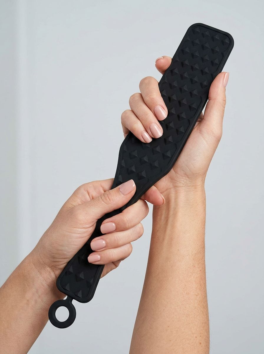 Bound To Please Silicone Studded Spanking Paddle, a luxurious silicone spanking paddle designed for ultimate impact and pleasure.