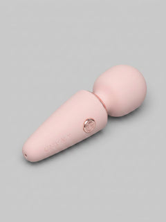 Le Wand Mini Micro Rechargeable Massage Wand Vibrator displayed elegantly with decorative elements - a sophisticated mini massage wand for intimate moments.