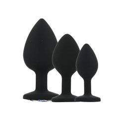 Toosh Silicone Butt Plug Set of 3 – Black with Clear Gem Base, demonstrating the comfortable insertion feature with a seamless finish.