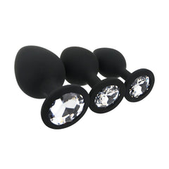 Close-up of the tapered tips on Toosh Silicone Butt Plug Set of 3 – Black with Clear Gem Base, designed for effortless insertion.