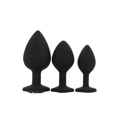 Visual representation of Toosh Silicone Butt Plug Set of 3 – Black with Clear Gem Base, showcasing the flared base for safety during use.