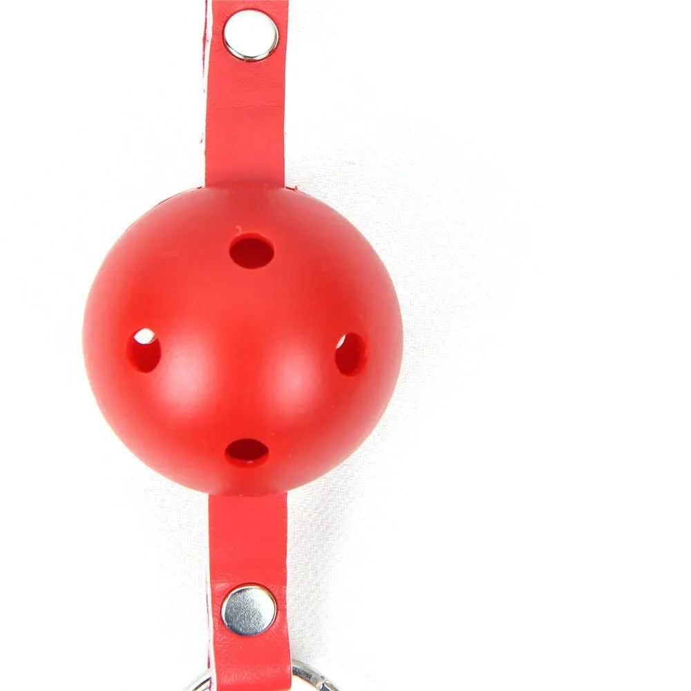 a red ball and strap on a white background
