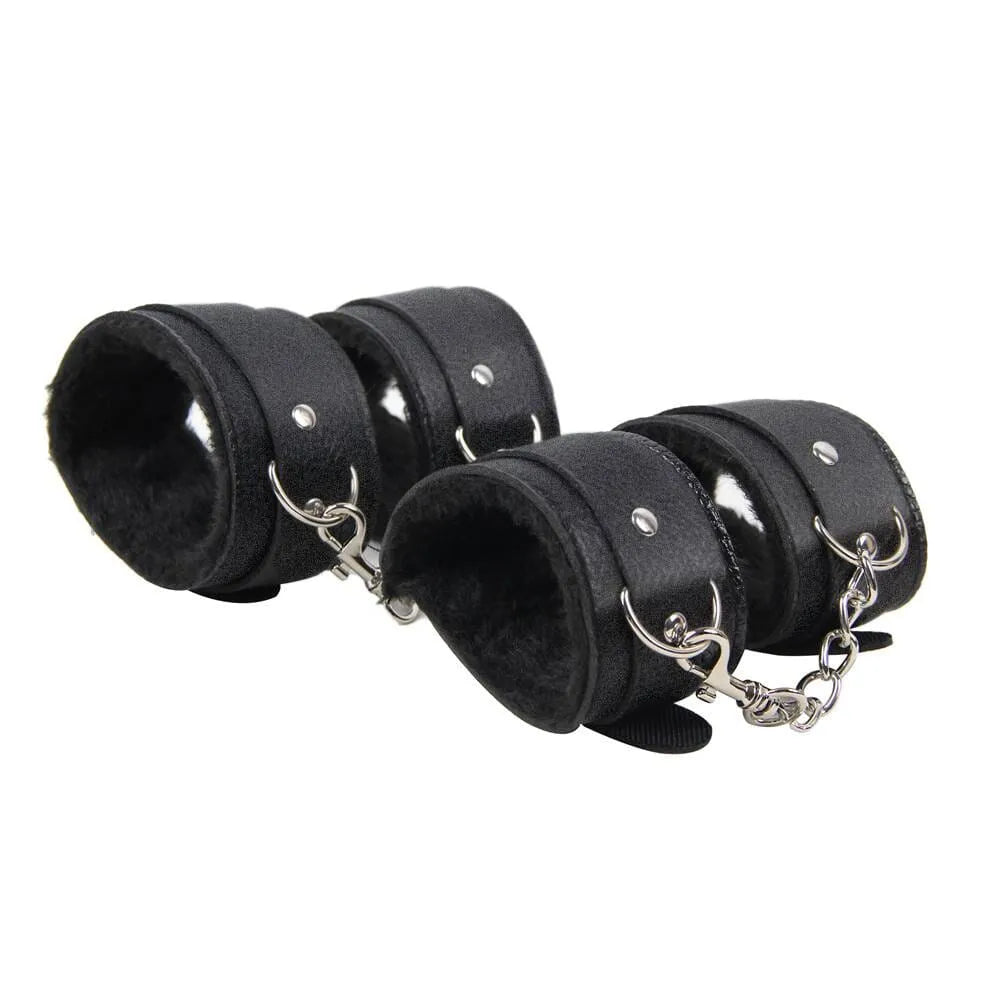 a set of four leather cuffs with chains