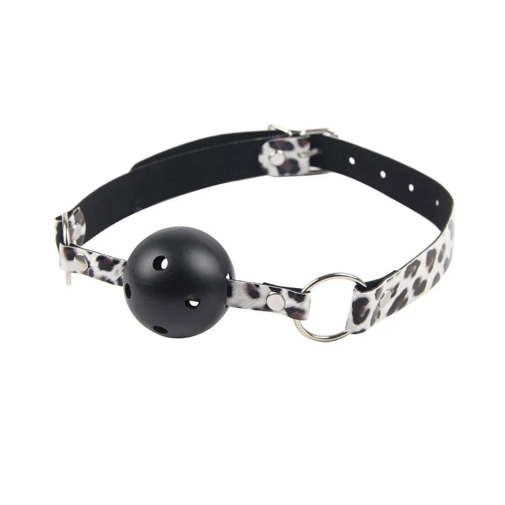 a black and white collar with a ball gag on it