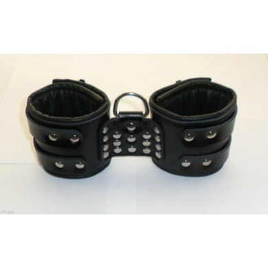 Off Pat Bondage Cuffs, adjustable restraint cuffs with secure fastening, made of durable material for bondage play.