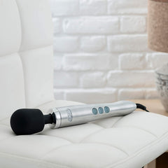 Doxy Die Cast Mains Powered Ultra Wand, a luxury personal massager with a sleek metal handle and smooth silicone shaft.
