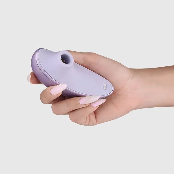 a person holding a purple object in their hand