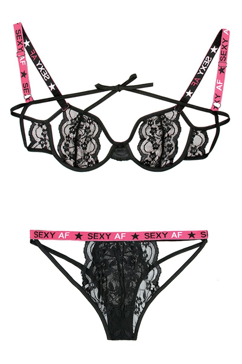 Vibes Fantasy Lace lingerie set featuring cut-out bra, caged panty, and "Sexy AF" slogan straps, designed for bold, seductive style.