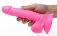 Thumbnail for a woman's hand holding a pink plastic object