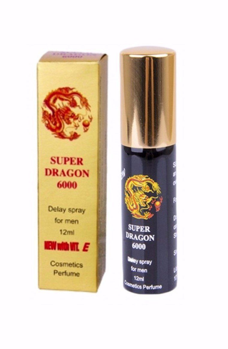 a bottle of dragon cologne next to a box