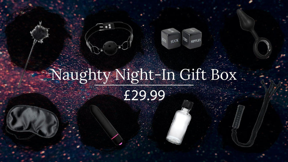 Scandals Naughty Night-In Bondage Kit gift box with restraints, blindfold, and accessories for adult intimate play.