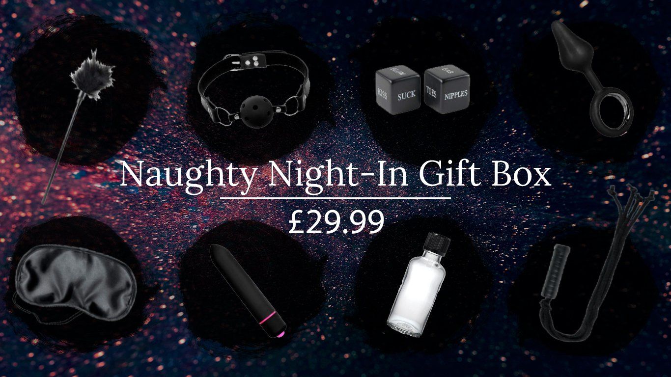 Scandals Naughty Night-In Bondage Kit gift box with restraints, blindfold, and accessories for adult intimate play.