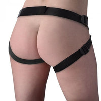 a woman wearing a black strap around her butt