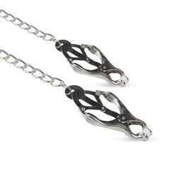 Stylish silver nipple clamps featuring cushioned tips and a connecting chain, crafted for comfort and aesthetic appeal during use.