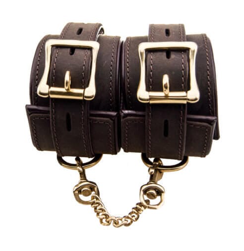 Bound to Please nubuck leather wrist restraints with soft padding for comfort, featuring secure closures and stylish design.