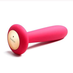 a close up of a pink object on a white background