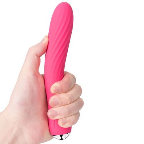 a person holding a pink object in their hand