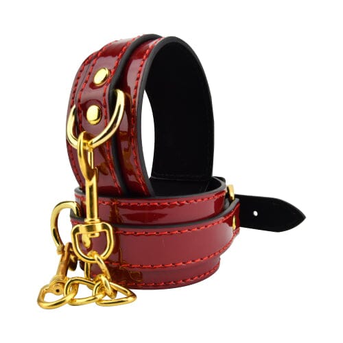 Red ankle cuffs by Bound to Please, secure metal restraints with adjustable straps for BDSM role-play or bondage activities.