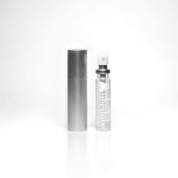 Thumbnail for a bottle of perfume sitting next to a silver tube